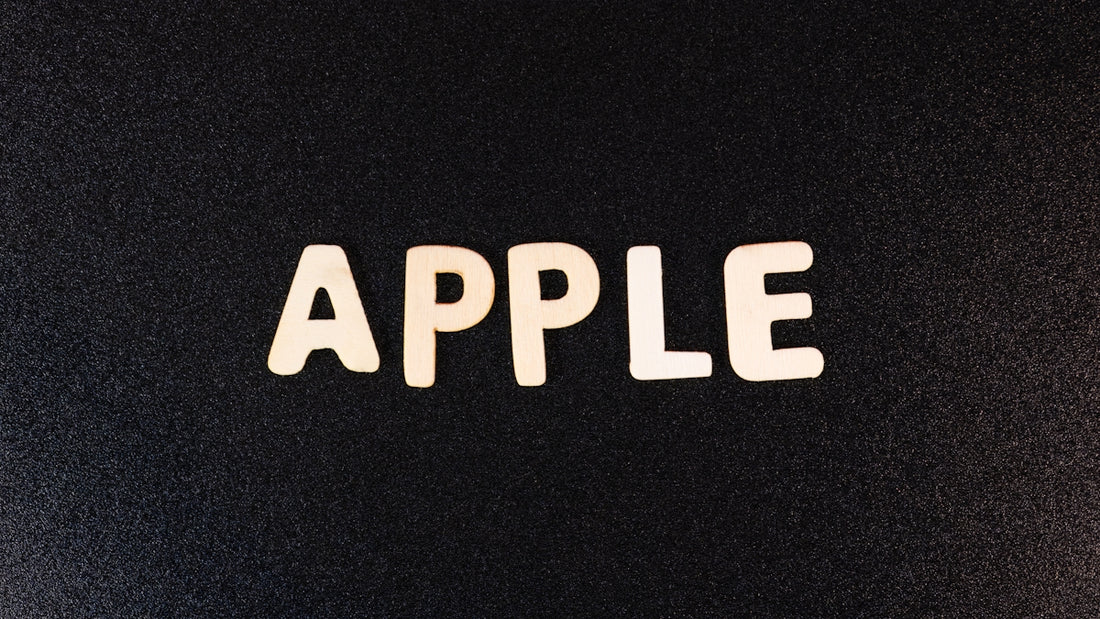 the word apple spelled with white letters on a black background