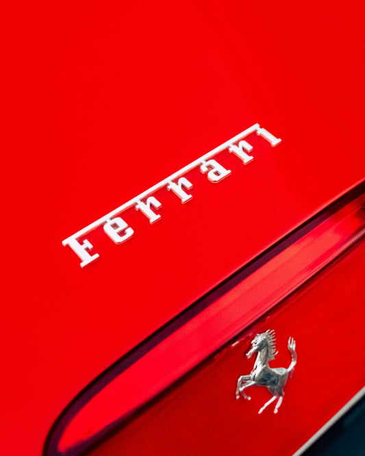 The ferrari logo is shown on a red car.