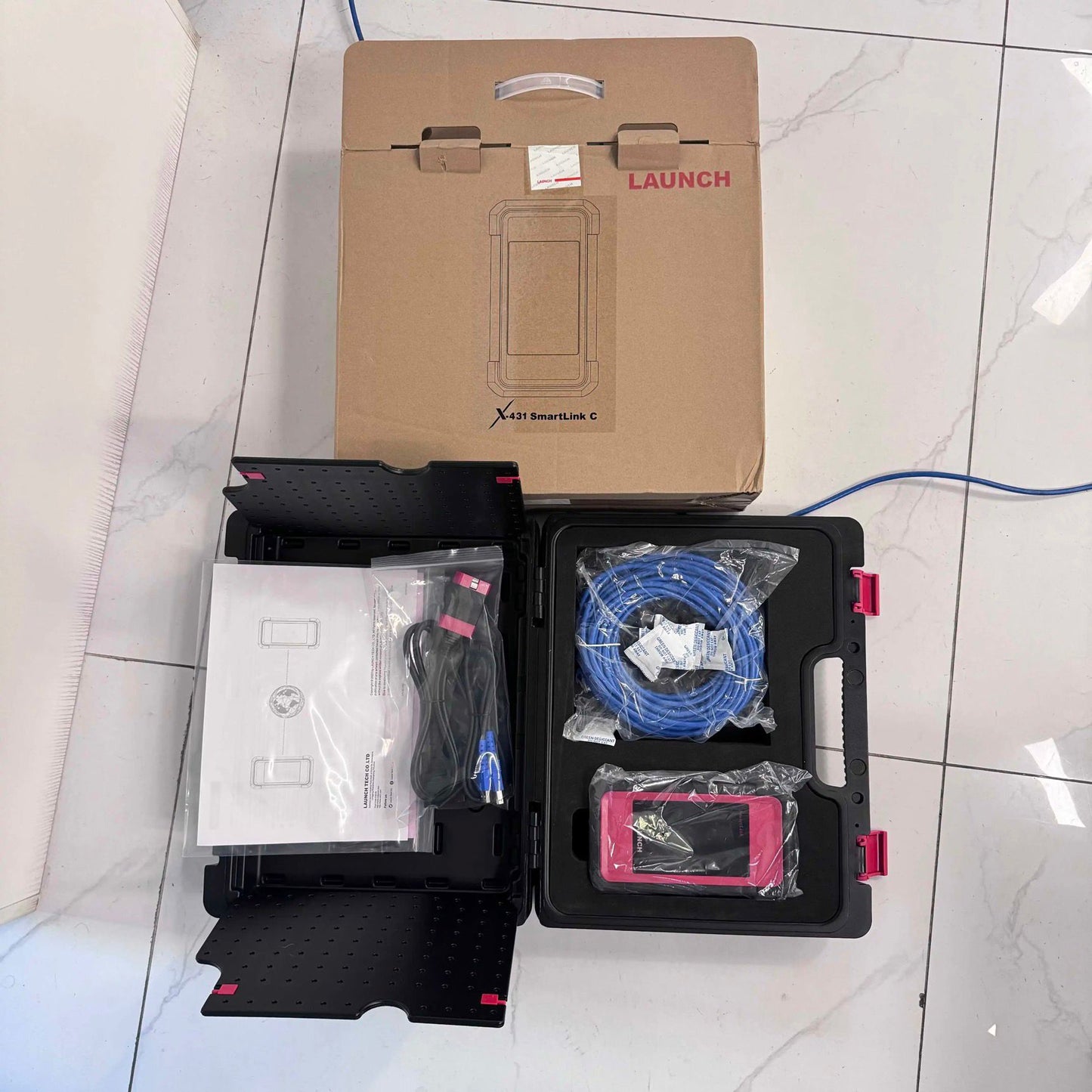 Launch X431 SmartLink C automotive diagnostic tool kit with cables and tablet in open case