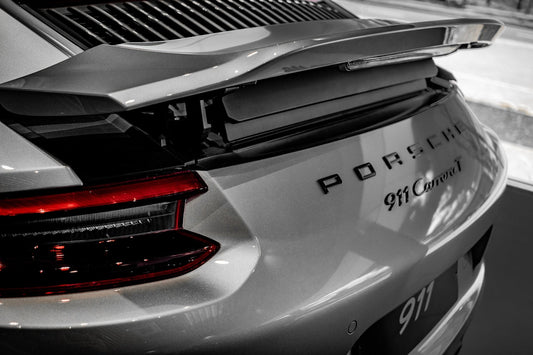 Close-up of Porsche 911 Carrera T rear with raised spoiler and tail light