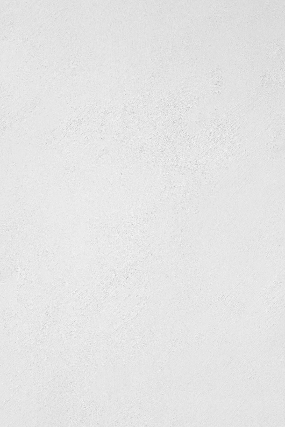 Plain white textured wall background for product or accessory display