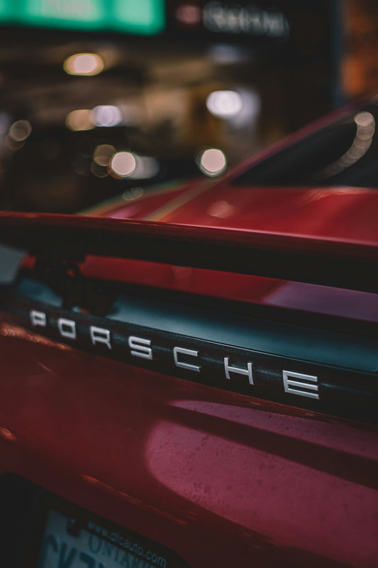parked red Porsche
