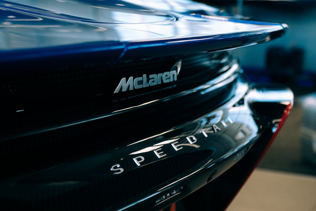 Close-up of McLaren Speedtail rear emblem, luxury supercar detail