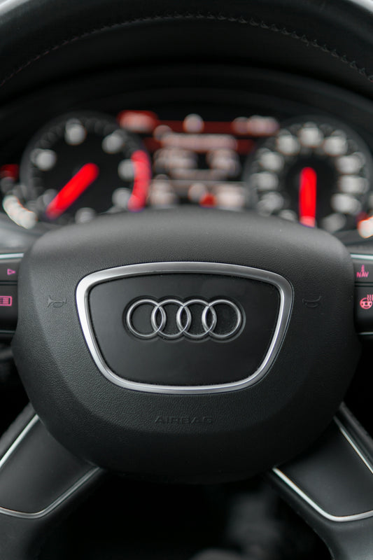 a steering wheel and dashboard of a car