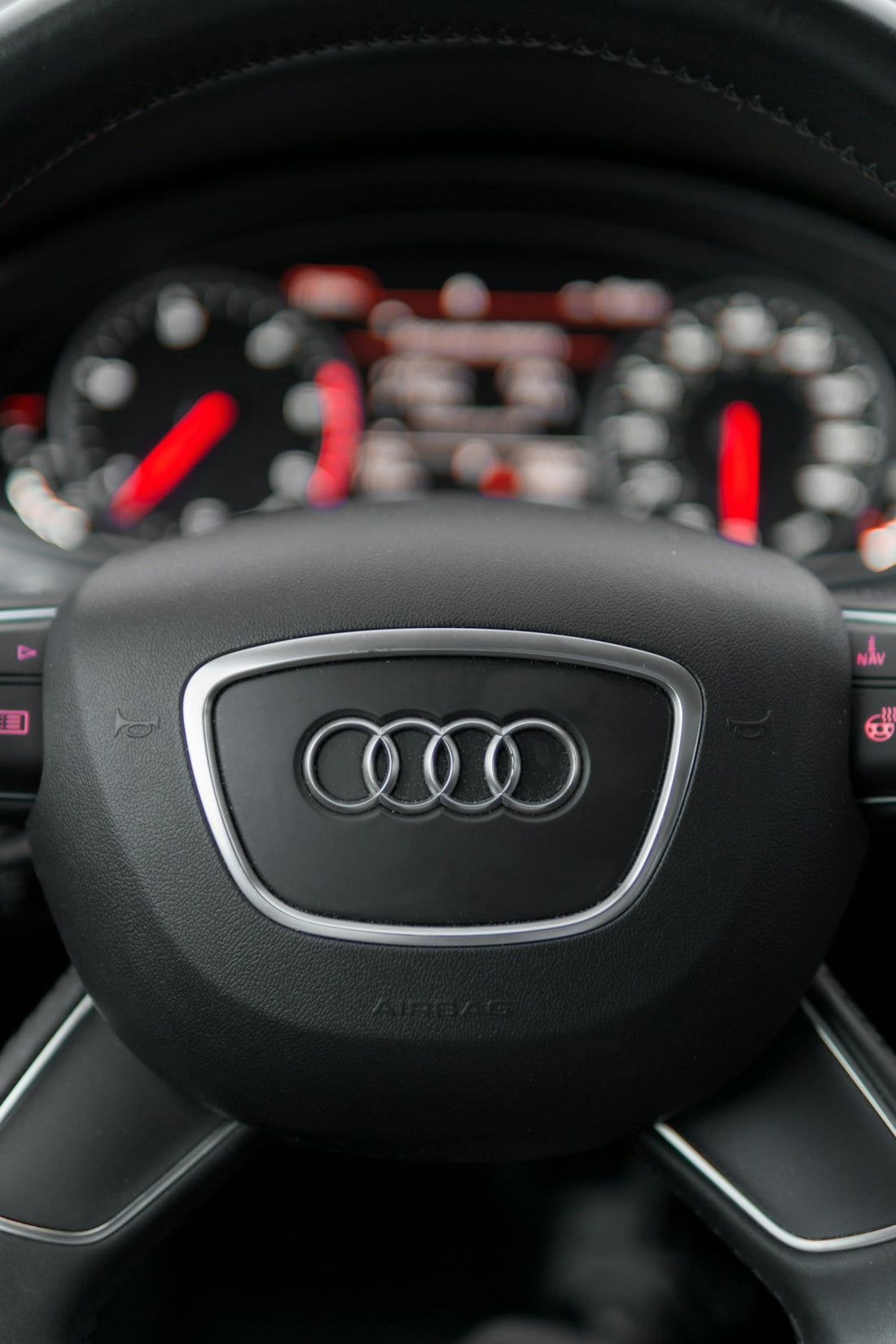 Audi steering wheel with dashboard, luxury car interior, premium vehicle accessories