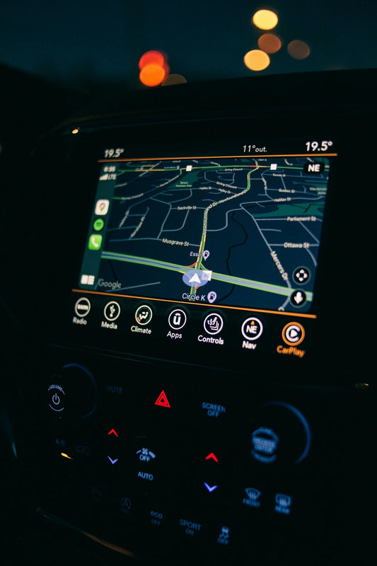 Modern car dashboard touchscreen displaying navigation with Apple CarPlay integration