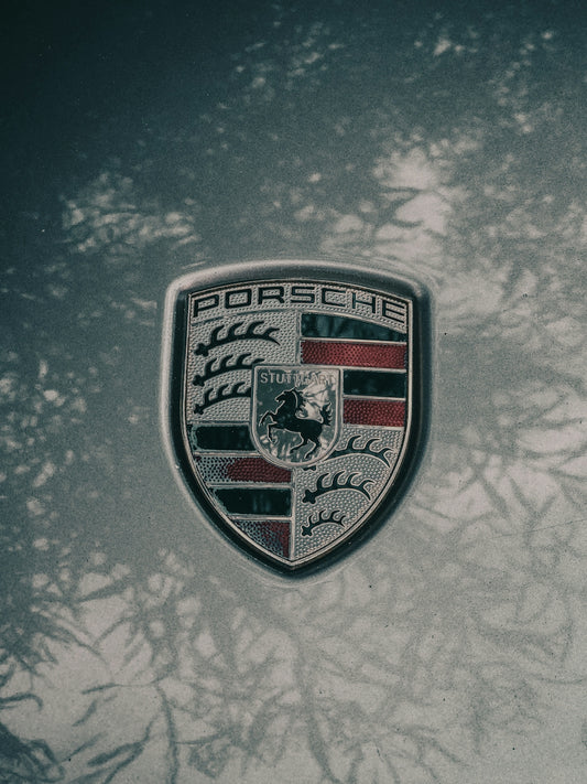 a porsche emblem is shown on a car