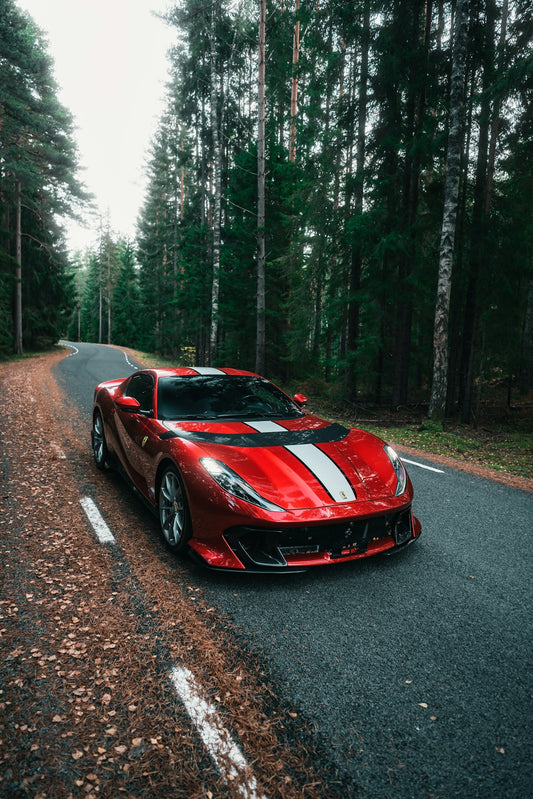a red sports car parked on the side of the road