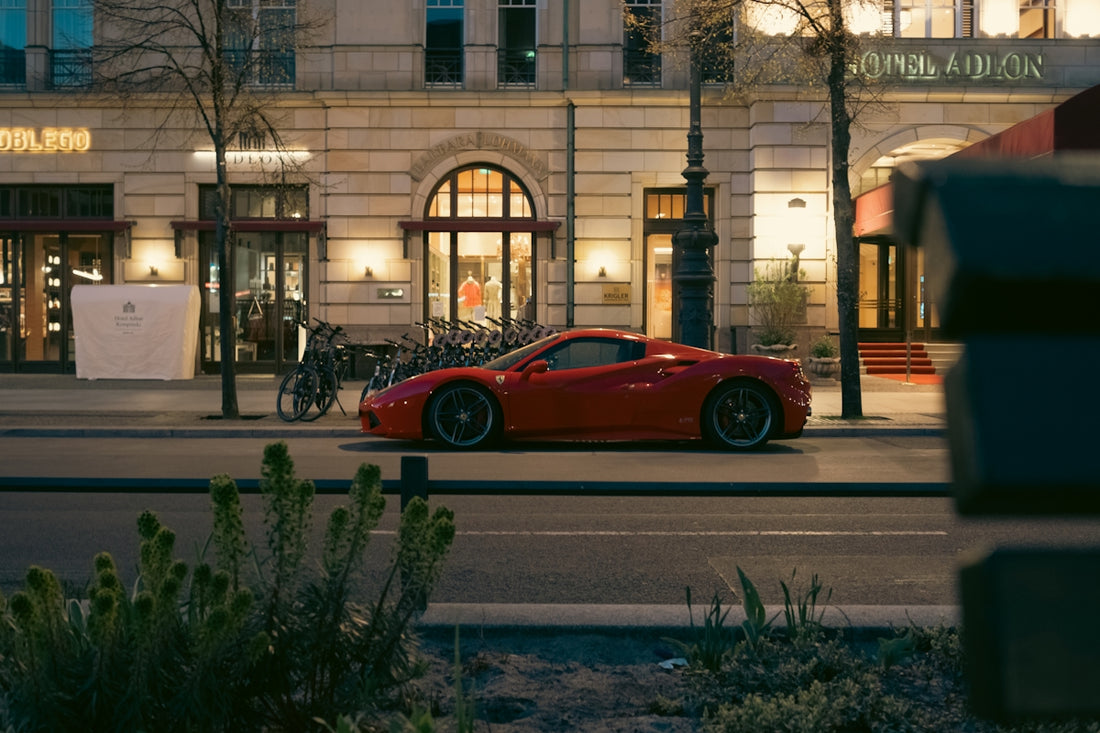 a red sports car parked in front of a building