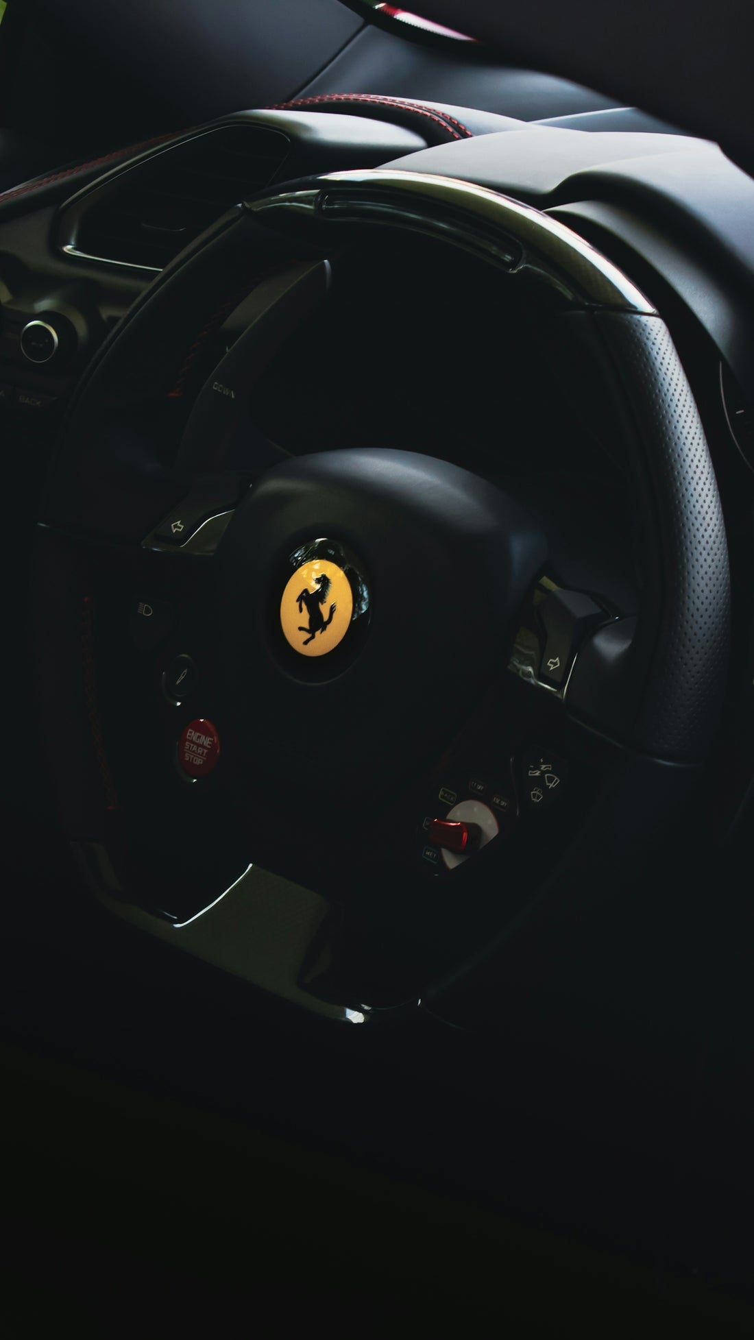 the steering wheel of a ferrari sports car
