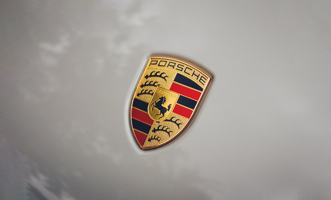 a close up of a porsche emblem on a car