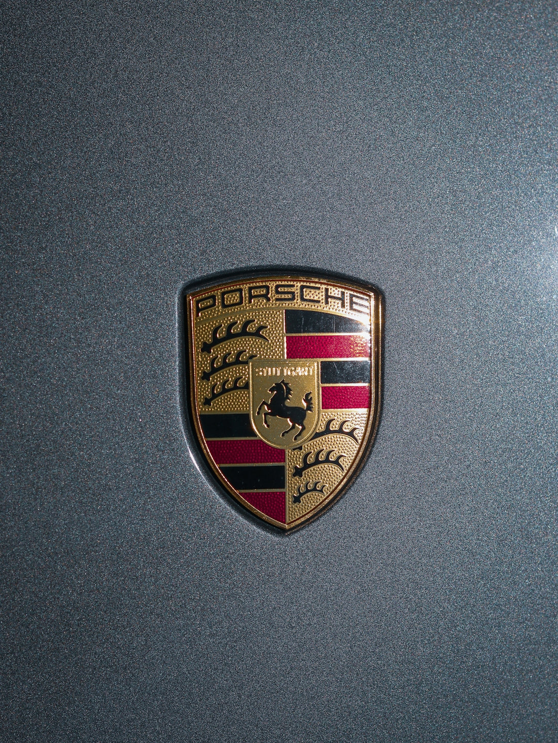 a close up of a porsche emblem on a car