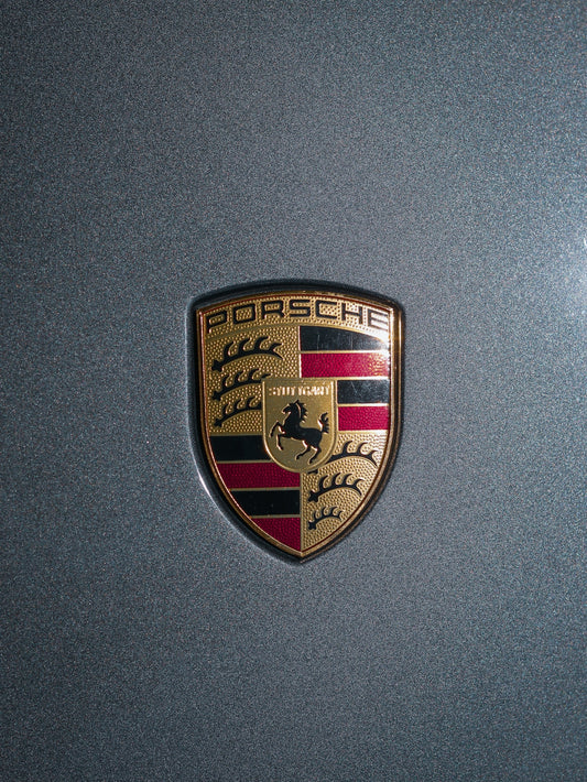 a close up of a porsche emblem on a car