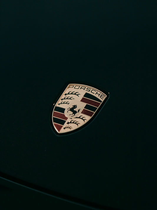 a close up of a porsche emblem on a car