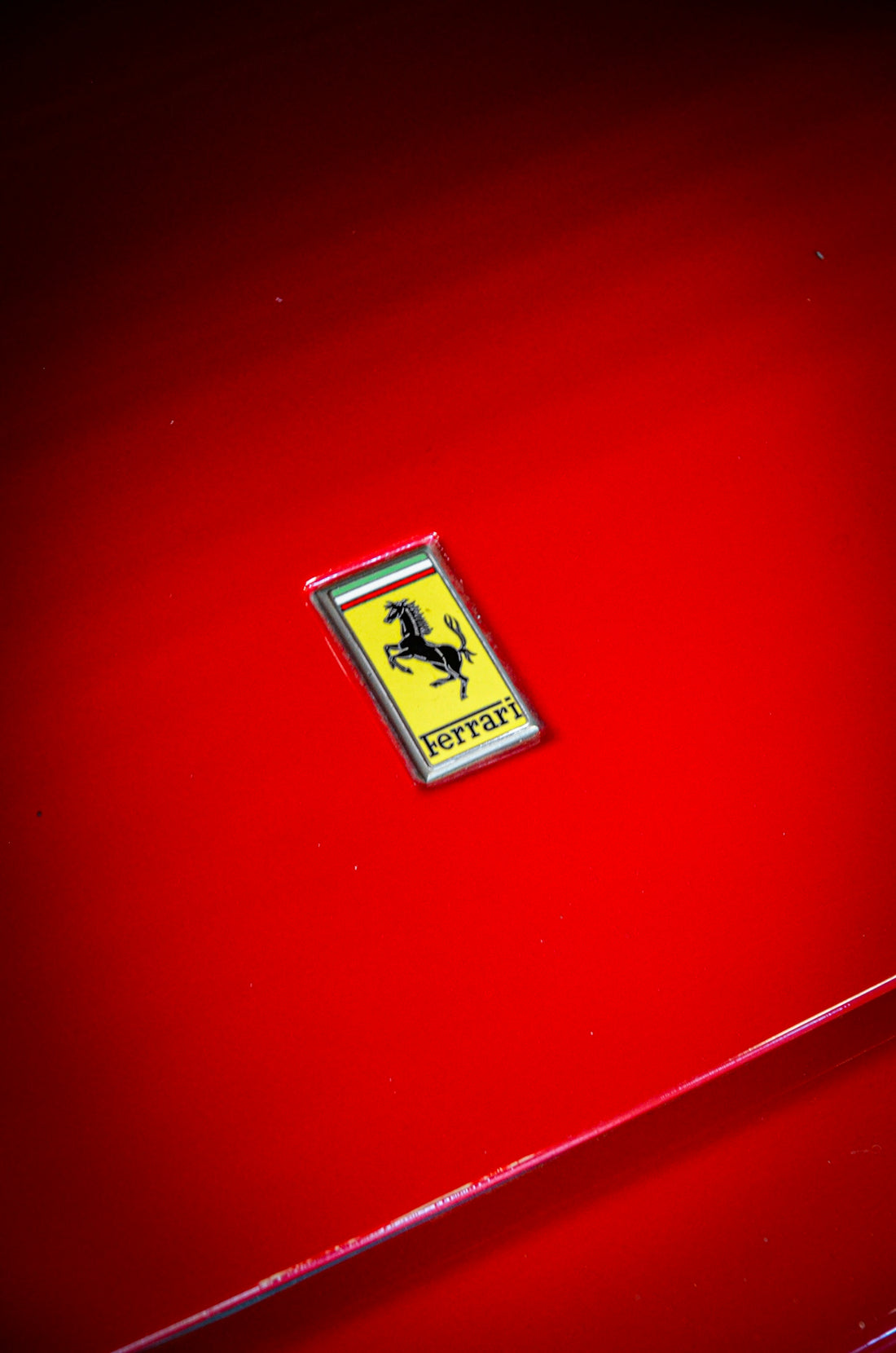 A red car with a ferrari emblem on it