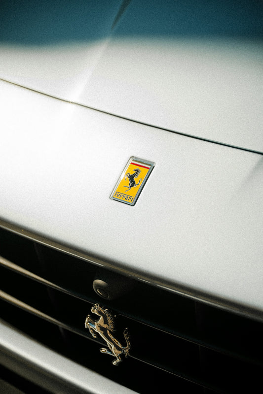 A ferrari badge is displayed on the car's front.