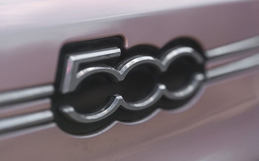 The fiat 500 logo is on the car.