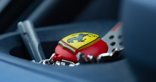 Ferrari keys resting inside of a car.