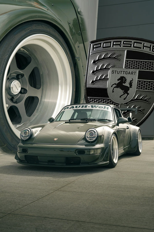 Custom Porsche sports car with wide body kit, close-up wheel, and Porsche badge outdoors