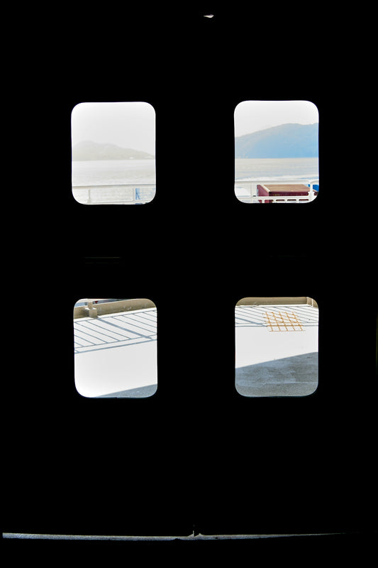 Four windows offer views of the sea.