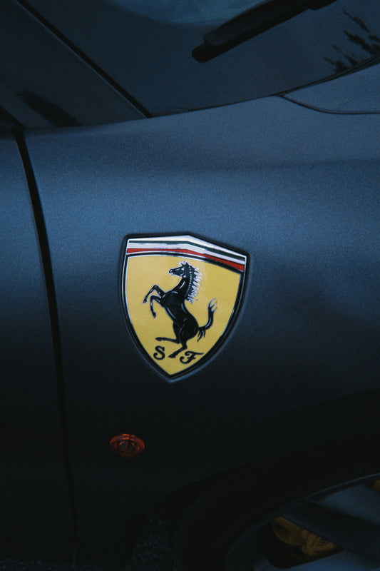 Ferrari emblem on a dark car