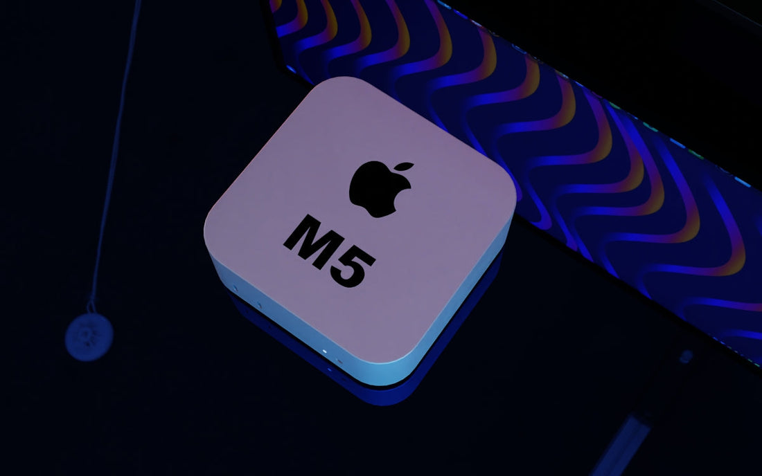 Apple M5 device on dark desk with modern LED lighting in the background