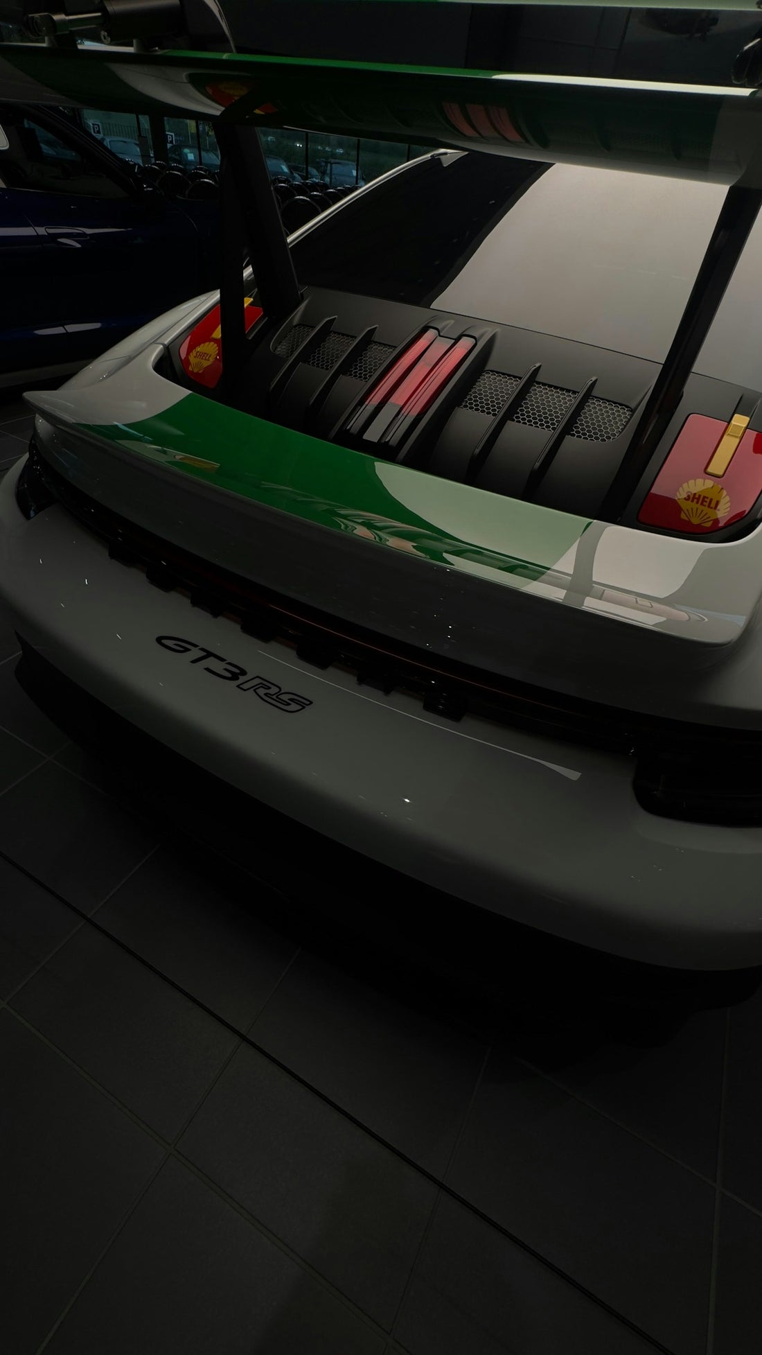 Rear view of a white porsche gt3 rs car.