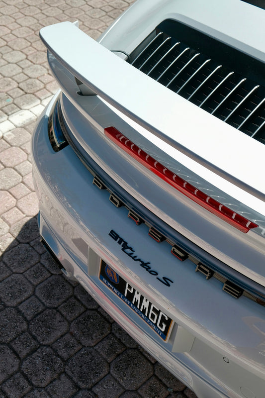 Rear view of a white porsche 911 turbo s