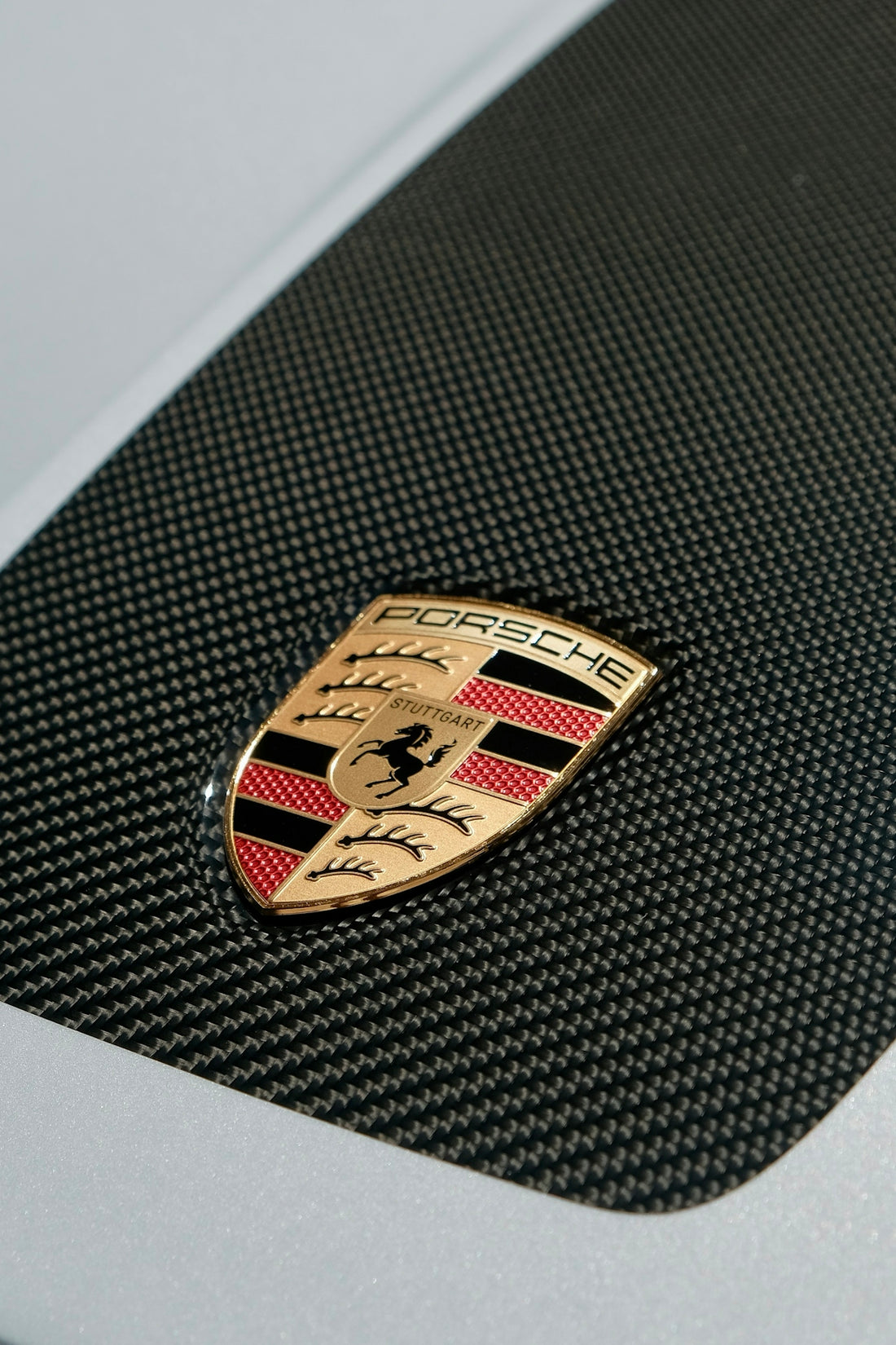 Porsche logo on carbon fiber hood